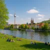Family picnic in Germany - a spring landscape with mountains, a river and a path of bicycles