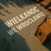 Easter in Wrocław - a bird&#39;s eye view view with an inscription arranged on a pavement among the fair and passers -by, next to the Gothic church
