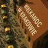 Wielkanoc w Krakowie – widok z lotu ptaka na jarmark wielkanocny przy kościele z napisem WIELKANOC W KRAKOWIE wpisanym realistycznie w dach
