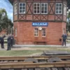 Miniature train station scene in Kolejkowo Wroclaw with figures and railway tracks